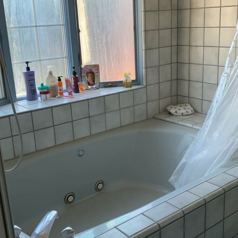 Step Up Construction - Old bathroom having a bathtub, bay window and no storage - General Contractors Near Me - San Jose, California