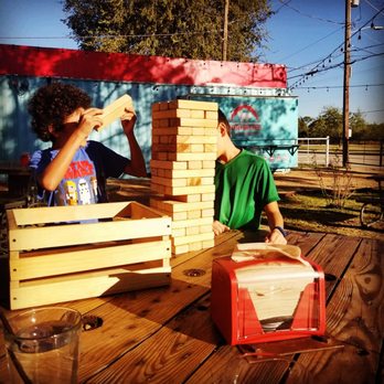 Kearney's Feed Yard - Our kids playing at our table. - Bars Near Me - Sunnyvale, Texas