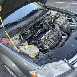 Tire Choice Auto Service Centers - Hood left open with tools still in it
