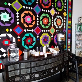 Rise'n Roll Bakery - coffee counter and a mural by local artist (Ne)Koda Witsken - Bakeries Near Me - Fishers, Indiana