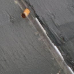 Cigarette butts on rook above the patio