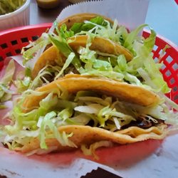 Los Compadres Mexican Taqueria - Can't tell from all the lettuce, but these are beef tongue tacos and al pastor tacos, delish!