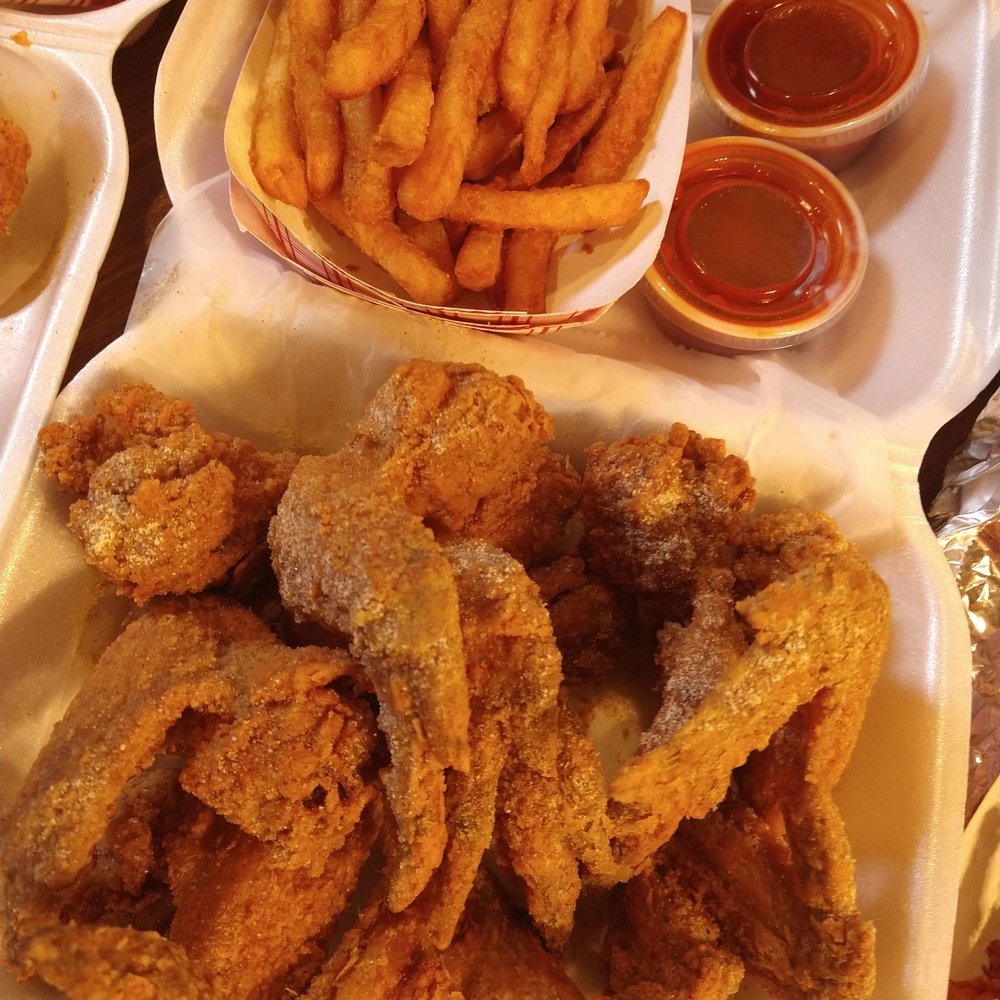 a tray of fried chicken and french fries