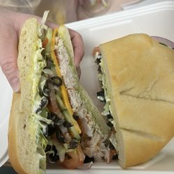 Village Baker - Turkey and cheese on sourdough roll with extra veggies (added olives, cucumbers, tomato, red onion)