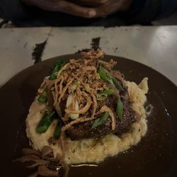 Michy's Relaxed Dining - Tenderloin sitting on mash potatoes