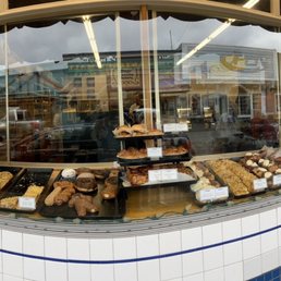 Exterior outside entrance of Sluys Poulsbo Bakery - A pano if all the delicious choices in the front window - Poulsbo, Washington Exterior outside entrance of Sluys Poulsbo Bakery - A pano if all the delicious choices in the front window - Poulsbo, Washington