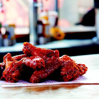 BurgerIM - a pile of chicken wings on a table - Burgers Near Me - Sugar Land, Texas BurgerIM - a pile of chicken wings on a table - Burgers Near Me - Sugar Land, Texas