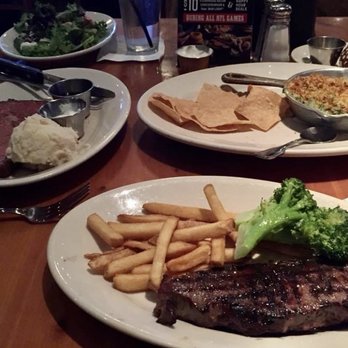 Black Angus Steakhouse - Baked Spinach & Artichoke Dip New York Steak W/ fries and Broccoli  Prime Rib w/ mashed potato and house salad - Steakhouses Near Me - Burbank, California