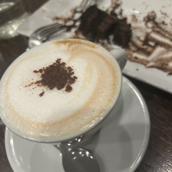 Orofino - Cappuccino with a very small slice left of chocolate cake - Italian Near Me - Fredericksburg, Virginia