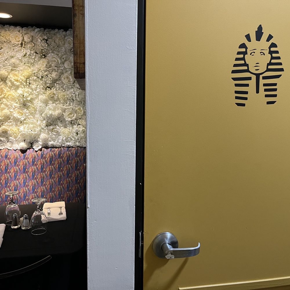 Bistro 55 - a yellow door with a stencil of an egyptian mask on it - Desserts Near Me - Flemington, New Jersey Bistro 55 - a yellow door with a stencil of an egyptian mask on it - Desserts Near Me - Flemington, New Jersey