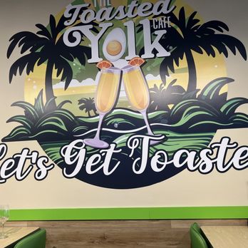 The Toasted Yolk Cafe - a sign that says let's get toasted - Breakfast & Brunch Near Me - Myrtle Beach, South Carolina