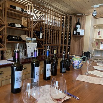 Laura Michael Wines - wine bottles and glasses on a bar - Wineries Near Me - Calistoga, California Laura Michael Wines - wine bottles and glasses on a bar - Wineries Near Me - Calistoga, California
