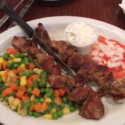 a plate of meat and vegetables