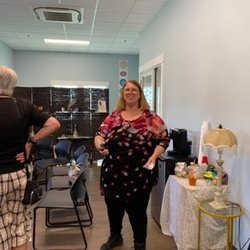 Awakening Moments Center - Angie D'Anjou, Spiritual Consultant giving a tour of the new facility to visitors at the Grand Opening.