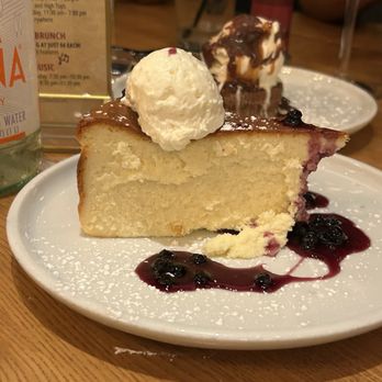 Max's Grille - Cheesecake and blueberry sauce - New American Near Me - Boca Raton, Florida Max's Grille - Cheesecake and blueberry sauce - New American Near Me - Boca Raton, Florida