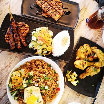 Satay Sate - several plates of food on a table - Indonesian Near Me - Toronto, Ontario