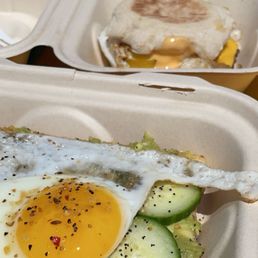 Avocado toast with egg and breakfast sandwich