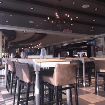 The Hearth - Urban chic ambiance at post security US departures - American Near Me - Mississauga, Ontario