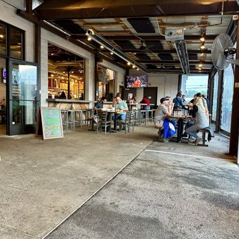 Tennfold Brewing - Outdoor patio is covered and has TVs - it's a great location for bad weather! - Pizza Near Me - Nashville, Tennessee Tennfold Brewing - Outdoor patio is covered and has TVs - it's a great location for bad weather! - Pizza Near Me - Nashville, Tennessee