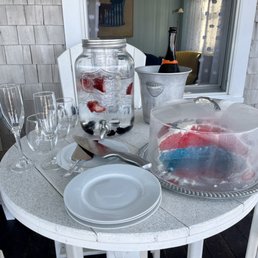 Goodies for the beach house guests placed beautifully on the porch for us to enjoy. Baked cake, fruit infused water and ice cold Prosecco.