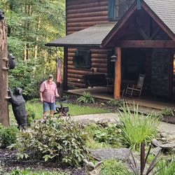 Lazy Bear Lodge Bed & Breakfast - Beautiful carved bear statue frames the entrance.