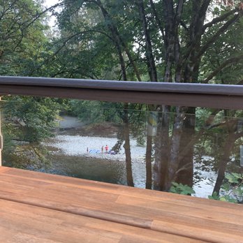 Cascadia Pizza - This was our view. Now all they need is a rope swing into the water right there! Now that would be some entertainment! Lol - Pizza Near Me - Maple Valley, Washington