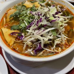 Au Lac - Bun Bo Hue, or Royal Noodle Soup, features our lemongrass and mushroom broth with rice noodles, plant-based meats, fresh mint and cabbage.