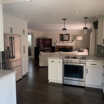 The Cabinet Pros - After; Raising the ceiling made the kitchen appear much larger and connected with the adjoining room. - Kitchen & Bath Near Me - Brea, California