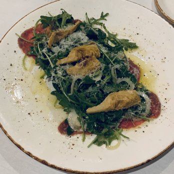 Riverwalk Cafe & Oyster Bar - Wagyu beef carpaccio with fried artichoke hearts and arugula - Seafood Near Me - Stuart, Florida Riverwalk Cafe & Oyster Bar - Wagyu beef carpaccio with fried artichoke hearts and arugula - Seafood Near Me - Stuart, Florida