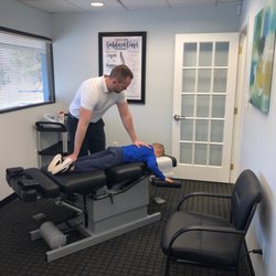 South Central Chiropractic - Dr. Collin Sheehan adjusts his son on his new tables!