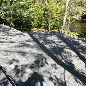 Fives Contracting - the roof of a home with a lake in the background - General Contractors Near Me - Medford, New Jersey