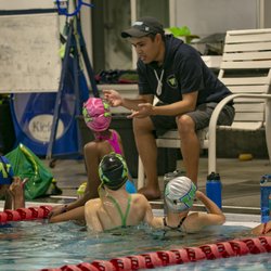 West Coast Aquatics - Coach working with swimmers