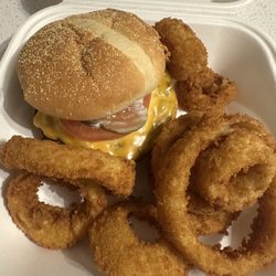 Cafe 544 - Deluxe burger with cheese and onion rings.