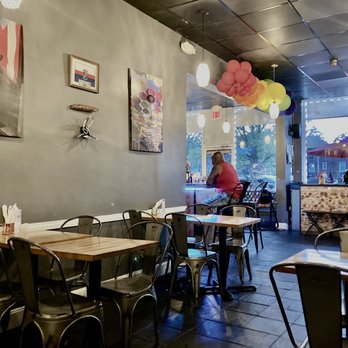 El Cantito Cafe - a woman sitting at a table - Latin American Near Me - Yonkers, New York El Cantito Cafe - a woman sitting at a table - Latin American Near Me - Yonkers, New York