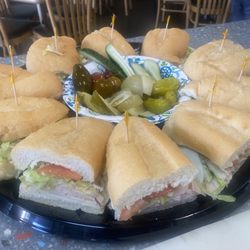 Jersey Joe's Deli - Sandwich tray with pickle assortment.