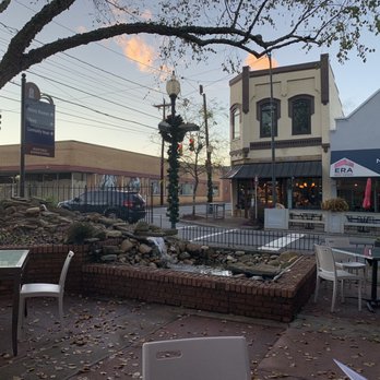 Root & Vine - a patio area with tables and chairs - New American Near Me - Morganton, North Carolina Root & Vine - a patio area with tables and chairs - New American Near Me - Morganton, North Carolina