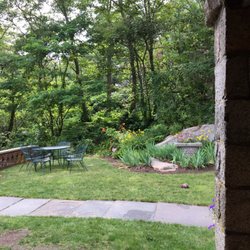 Stone Mansion - A patio area in the grass