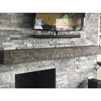 Leoline - a picture of a tv mounted on a brick wall - Handyman Near Me