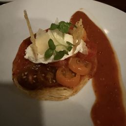 Tomato puff pastry tart, Old-fashioned mustard, herbes de Provence, lemon cream with Parmesan cheese Tomato puff pastry tart, Old-fashioned mustard, herbes de Provence, lemon cream with Parmesan cheese