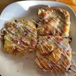 Pomodoro, chicken parm, and carbonara pizza slices