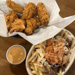 Chicken wings and small bulgogi kimchi cheese fries Chicken wings and small bulgogi kimchi cheese fries