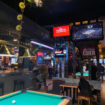 Ivanhoe Pub - a pool table in the foreground - Pubs Near Me - Vancouver, British Columbia