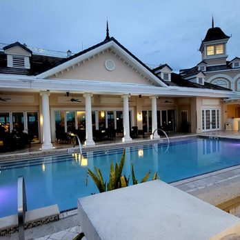 7593 Chophouse - a large pool in the evening - Steakhouses Near Me - Reunion, Florida 7593 Chophouse - a large pool in the evening - Steakhouses Near Me - Reunion, Florida