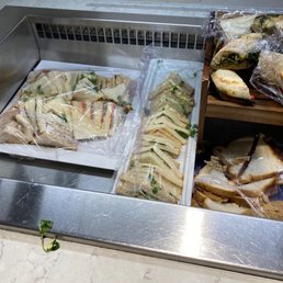 Business lounge. Old picked through sandwich's. The wine and beer fridge was locked. Could not find anyone to assist us.