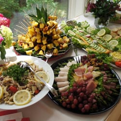 Catering by Kowalski's - Chipotle lime shrimp & pineapple skewers (has a kick!), and Asparagus & Pear Roulade tray. Both delicious and beautifully presented!