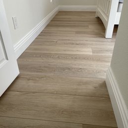 Done! Done! Done! nice painted baseboards and fresh spc flooring!