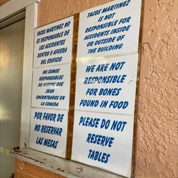 a sign on the wall of a restaurant a sign on the wall of a restaurant