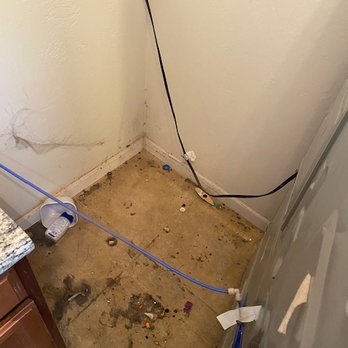 Tucson Maids - Before cleaning under oven on move-out clean - Home Cleaning Near Me Tucson Maids - Before cleaning under oven on move-out clean - Home Cleaning Near Me