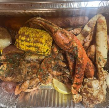 Happy Tails Seafood - Shrimp, crab legs, sausage, corn, potatoes served in very spicy cajun butter sauce. - Seafood Near Me - Mobile, Alabama Happy Tails Seafood - Shrimp, crab legs, sausage, corn, potatoes served in very spicy cajun butter sauce. - Seafood Near Me - Mobile, Alabama
