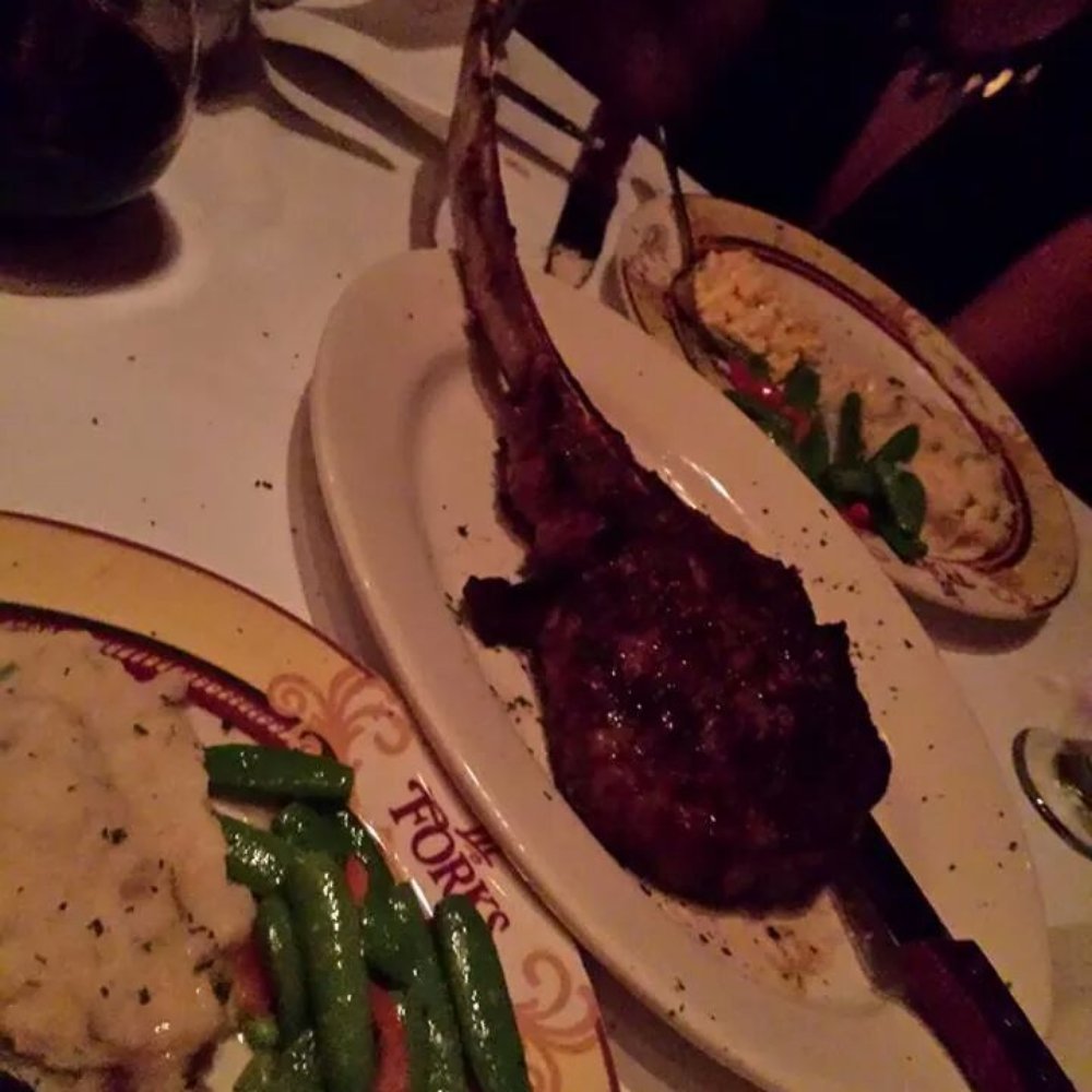 III Forks - His tomahawk ribeye steak, so juicy! - Steakhouses Near Me - Frisco, Texas